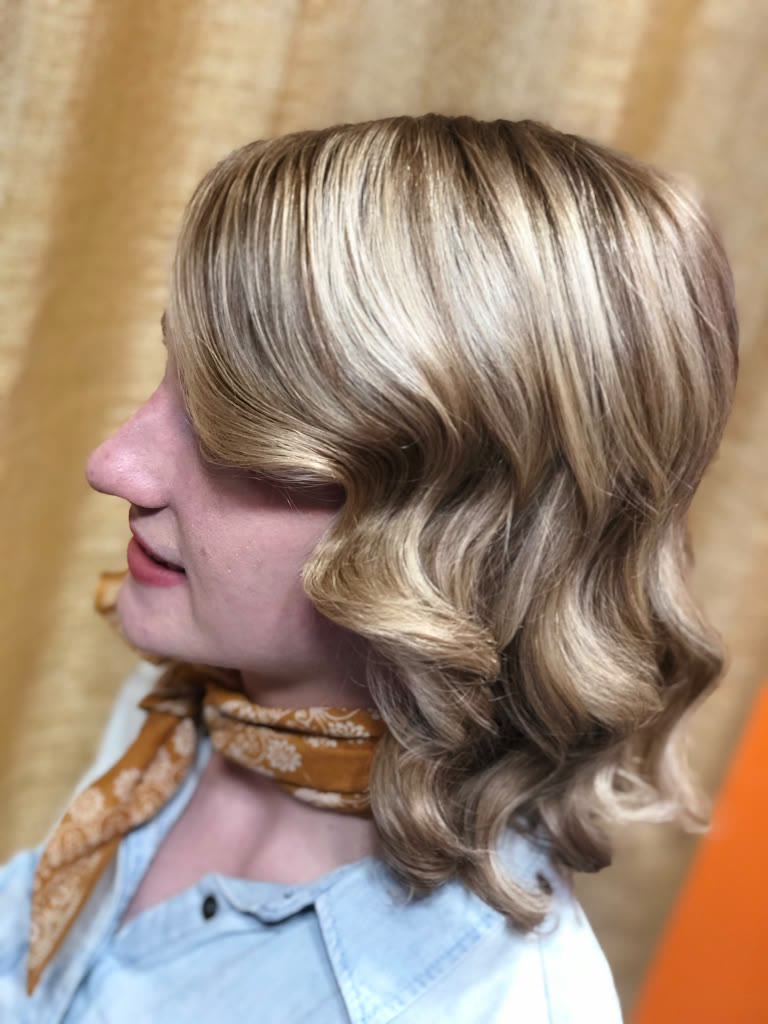 Blonde vintage waves on a shoulder-length cut