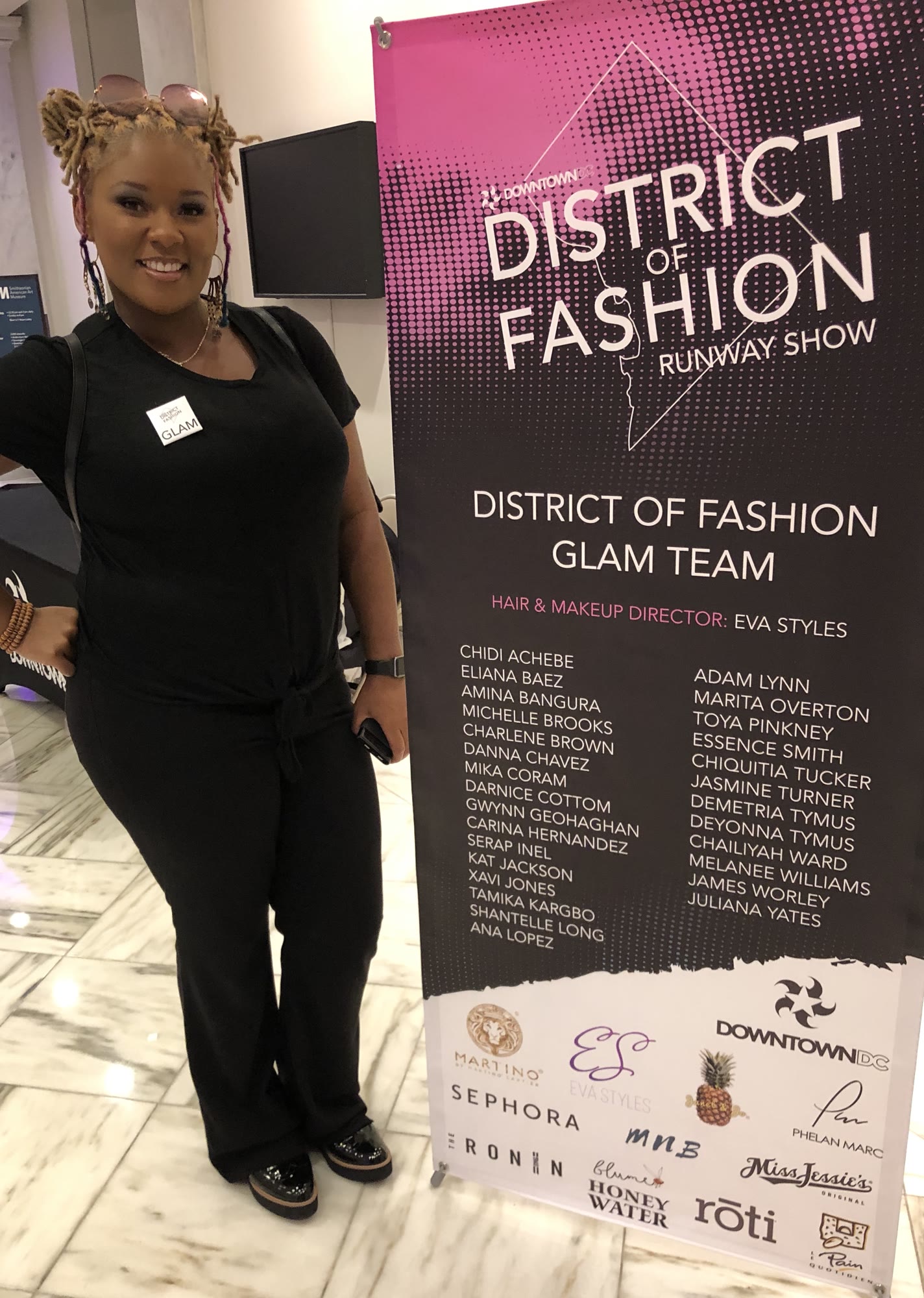 Enigma of Enigmatic beside the District of Fashion Runway Show glam team banner in Washington, DC